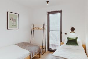 Posteľ alebo postele v izbe v ubytovaní Nalu Beach - luksusowe domki na plaży