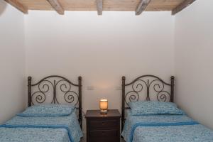 A bed or beds in a room at Villa Marisa