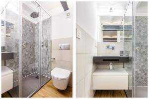 La salle de bains est pourvue d'une douche et de toilettes. dans l'établissement Precioso Ático de diseño, gran Terraza y Garaje en pleno centro, à Séville