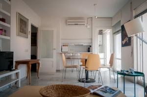 a living room with a table and chairs at NUEVA CAZORLA BELLA VISTA in Cazorla