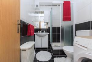 a bathroom with a toilet and a sink at Apartment Alen in Makarska +38 photos