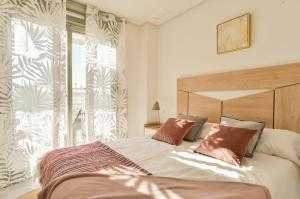 Ένα ή περισσότερα κρεβάτια σε δωμάτιο στο 215 Penthouse SPA GOLF - Alicante Holiday +47 φωτογραφίες