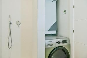 a washer and dryer in a white bathroom at 215 Penthouse SPA GOLF - Alicante Holiday in Villamartin