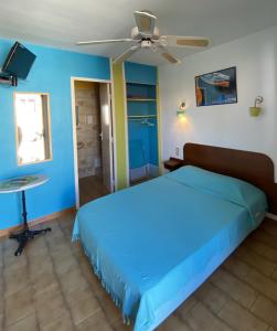 Voodi või voodid majutusasutuse Hotel Las Cigalas toas