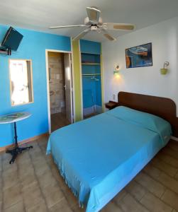Postel nebo postele na pokoji v ubytování cit'hotel Hotel Las Cigalas