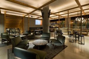 a lobby with chairs and tables and a bar at NOHGA HOTEL KIYOMIZU KYOTO in Kyoto