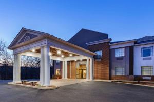 a large house with a pavilion in front of it at Days Inn by Wyndham Alta Vista in Altavista