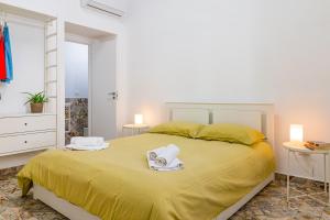 Postel nebo postele na pokoji v ubytování Via Malta Cozy Apartments near Ortigia