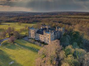 an aerial view of a castle in a field at Lumley Castle Hotel in Chester-le-Street