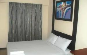 Postel nebo postele na pokoji v ubytování Hotel Seniman