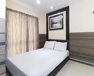 Postel nebo postele na pokoji v ubytování Hotel Seniman