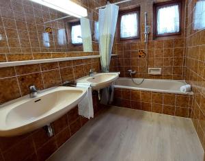 Kúpeľňa v ubytovaní Appartements MAGLOV