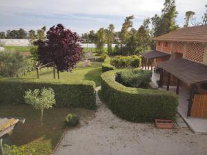 an overhead view of a garden with bushes and trees at Agriturismo Il Fienile in Sabaudia