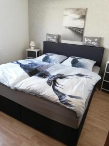 מיטה או מיטות בחדר ב-Haus Brockenblick