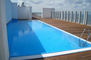 a swimming pool on the balcony of a house at Promenada Gwiazd by Baltic Home in Międzyzdroje