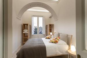 A bed or beds in a room at VITTORIO EMANUELE HOUSE
