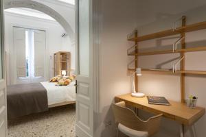 A bed or beds in a room at VITTORIO EMANUELE HOUSE