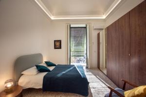 A bed or beds in a room at VITTORIO EMANUELE HOUSE