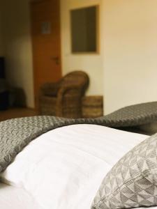 Postel nebo postele na pokoji v ubytování Volcano Hotel