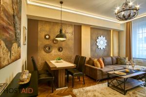 A seating area at R7 Design Apartment - hostAID