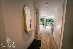 a hallway with a large mirror on a wall at La Perla in Lindau