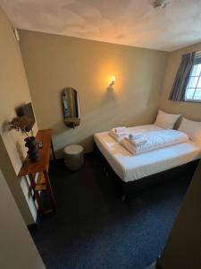 Postel nebo postele na pokoji v ubytování Hotel Oostereiland
