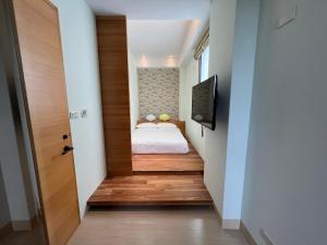 Postel nebo postele na pokoji v ubytování iLiving B&B
