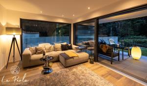 a living room with a couch and a table at La Perla in Lindau +20 photos