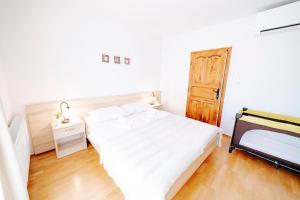Postel nebo postele na pokoji v ubytování Villa Alma