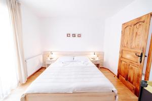 Postel nebo postele na pokoji v ubytování Villa Alma
