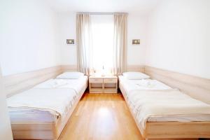 Postel nebo postele na pokoji v ubytování Villa Alma