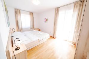 Postel nebo postele na pokoji v ubytování Villa Alma