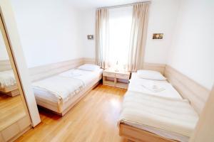 Postel nebo postele na pokoji v ubytování Villa Alma