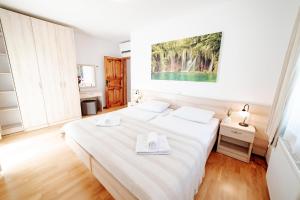 Postel nebo postele na pokoji v ubytování Villa Alma