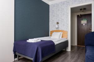Voodi või voodid majutusasutuse Hotel Vännäs toas