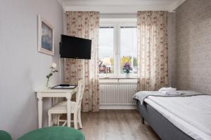 Voodi või voodid majutusasutuse Hotel Vännäs toas