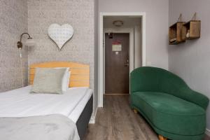 Voodi või voodid majutusasutuse Hotel Vännäs toas