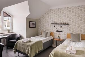 Voodi või voodid majutusasutuse Hotel Vännäs toas