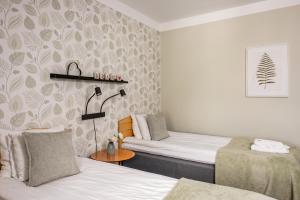 Voodi või voodid majutusasutuse Hotel Vännäs toas