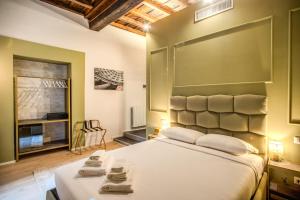 Capranica Private Suites客房内的一张或多张床位
