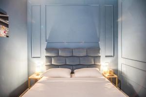 Capranica Private Suites客房内的一张或多张床位