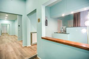 a view of the lobby of a building with a counter at Capranica Private Suites in Rome