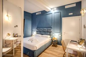Capranica Private Suites客房内的一张或多张床位