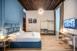 Capranica Private Suites客房内的一张或多张床位