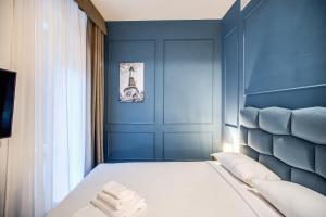 Capranica Private Suites客房内的一张或多张床位