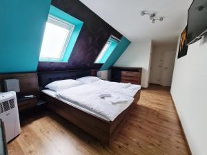Ein Bett oder Betten in einem Zimmer der Unterkunft DM Hotels & Apartments - Apartment Pfarrgasse 09
