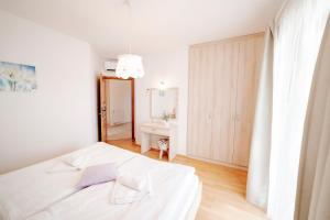 Postel nebo postele na pokoji v ubytování Villa Begonia