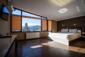 TV a/nebo společenská místnost v ubytování Siberia Hotel