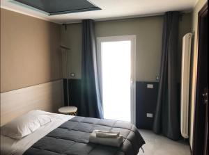 Posteľ alebo postele v izbe v ubytovaní Villa Camilla Milano