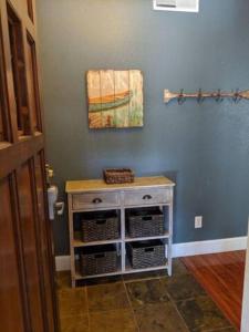 a blue room with a cabinet with baskets on it at Next to Lake, Pool, 10 Acre Park, 1 Mile to Town, Best Prices in Chelan